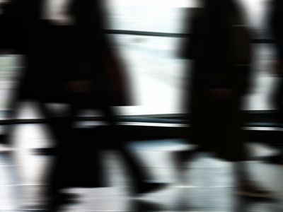 Blurred silhouette of a person jumping in motion